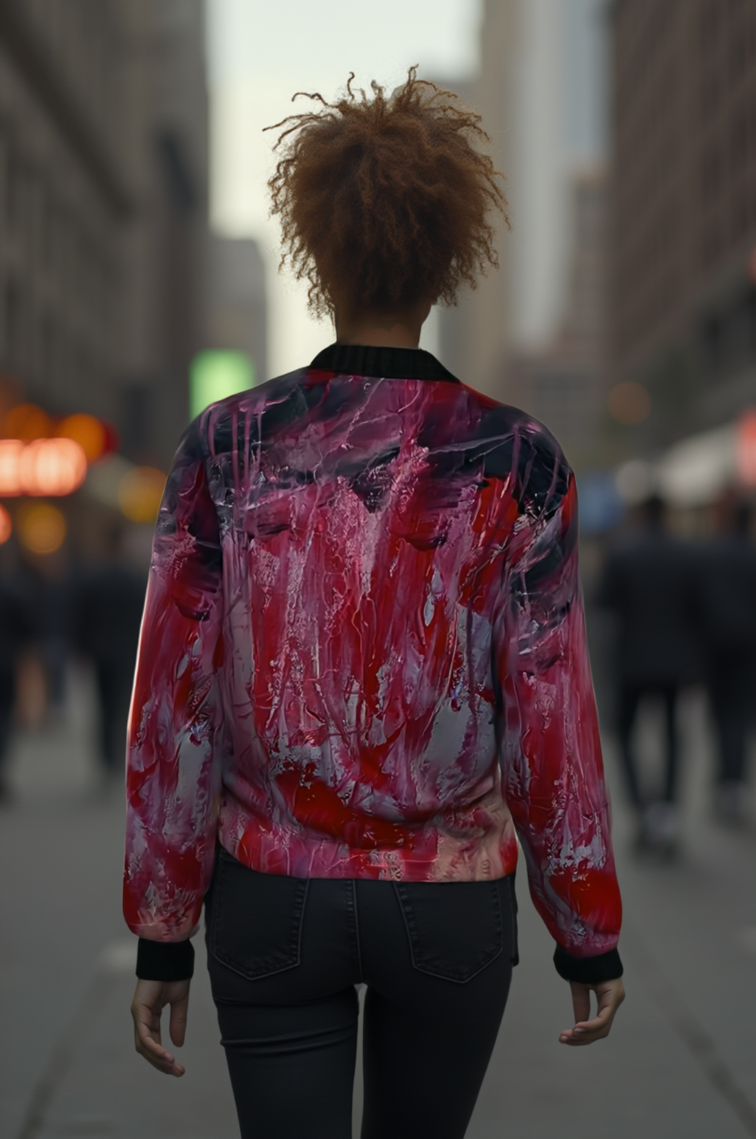 Woman wearing a colorful jacket walking on a city street