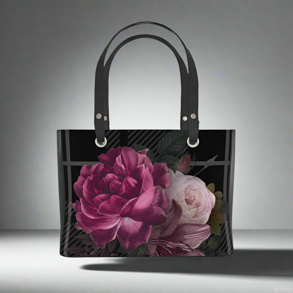 Black tote bag with floral design on a white background