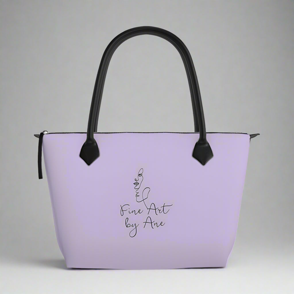 Purple handbag with black handles and text on a white background