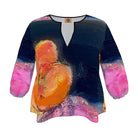 Colorful long-sleeve top with abstract design on a white background

