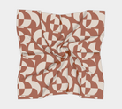 Geometric patterned fabric square on a white background